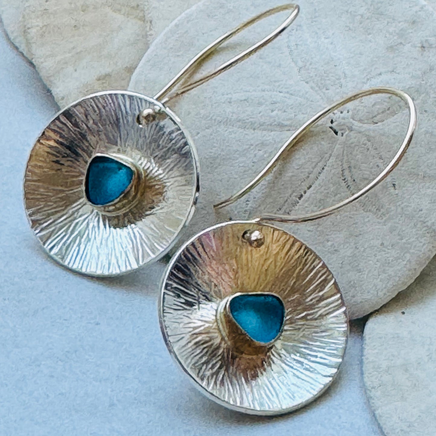 The Coin Earrings in a Flower Design