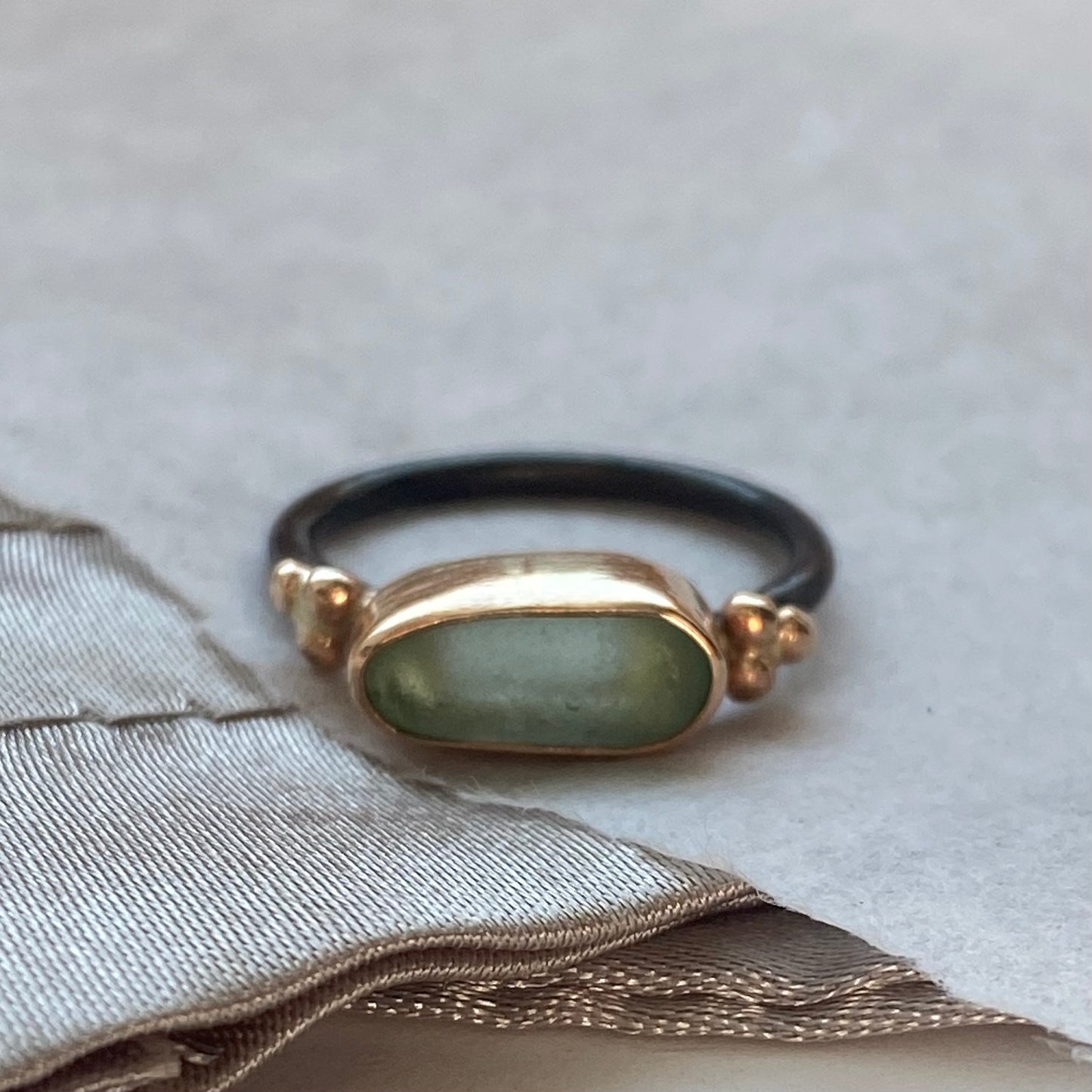 The Cluster Ring features a beautiful piece of sea glass nested in a handcrafted 14k gold-filled bezel with a delicate decorative gold clusters.