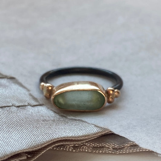 The Cluster Ring features a beautiful piece of sea glass nested in a handcrafted 14k gold-filled bezel with a delicate decorative gold clusters. 