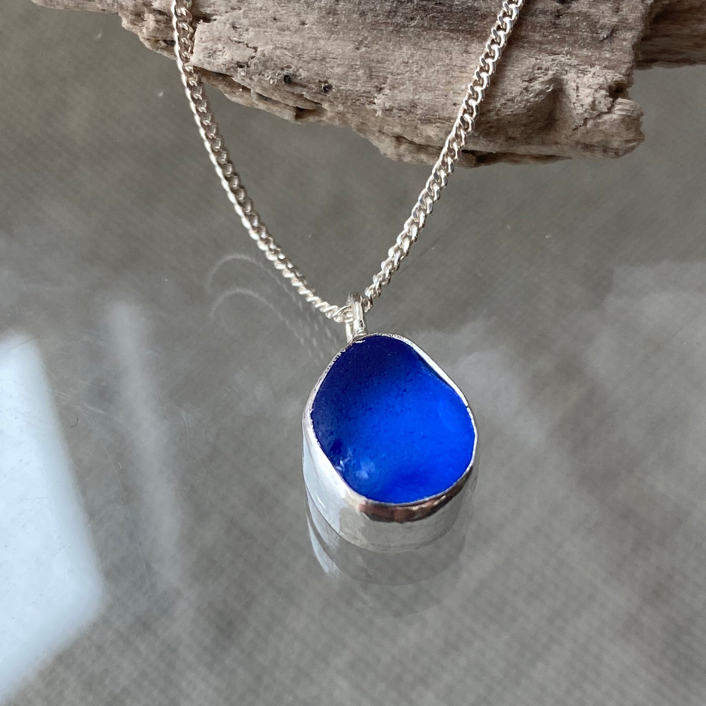 Deep cobalt blue Cornish sea glass pendant set buy into a fine silver bezel setting,blue Cornish sea glass pendant set in silver, something blue